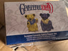 Box of Grateful Dead ceramic salt and pepper shakers on a cardboard surface