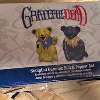 Box of Grateful Dead ceramic salt and pepper shakers on a cardboard surface