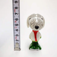 Cacahuetes - Agujero en una figura de Snoopy Hound de Enesco D56